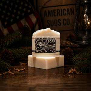 American Suds Co. handcrafted cold processed soap bar with oat powder for light grit, mountain top design, white color, and a semi sweet vanilla bourbon scent.