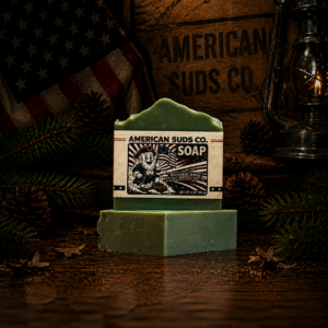 American Suds Co. handcrafted cold processed soap bar with mountain top design, green color, and a clean cedar, musk and lavender scent.