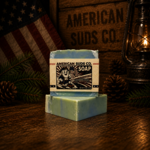 American Suds Co. handcrafted cold processed soap bar with swirly flat top, green and blue colored swirl, and a mint and eucalyptus scent with jojoba beads for light grit / exfoliation.