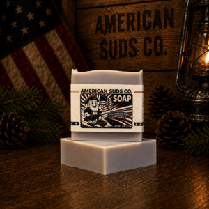 American Suds Co. handcrafted cold processed soap bar with sea clay for a light gray color, and a crisp tobacco and bay leaf scent.
